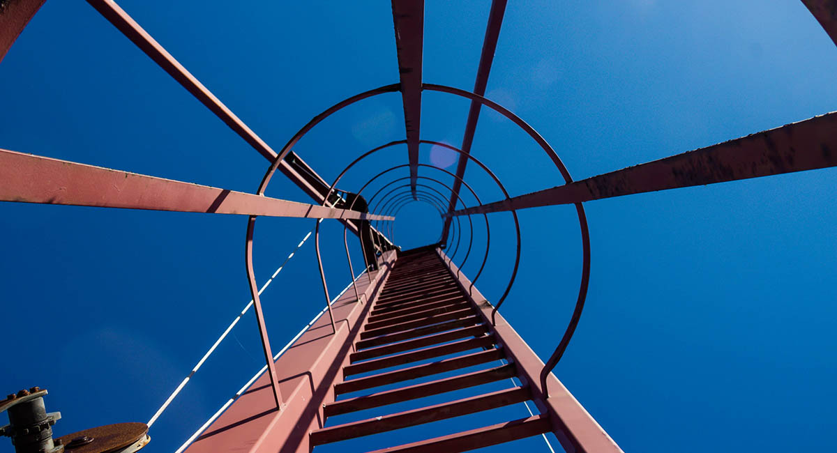ladder view upwards with blue sky