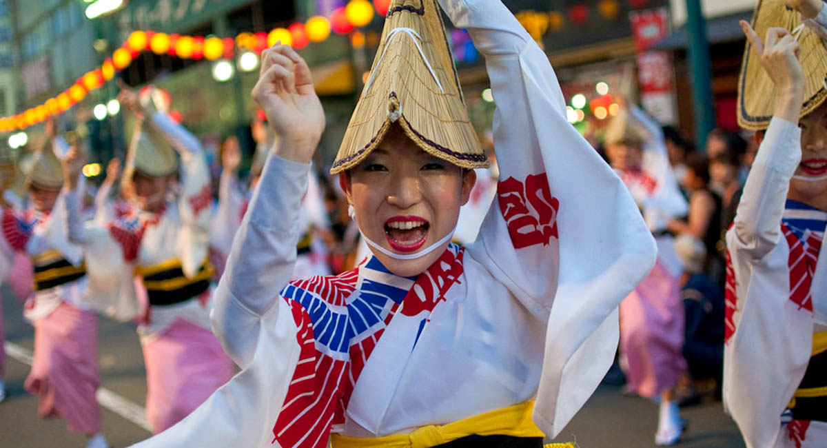 Woman dancing in Japanese festival costume