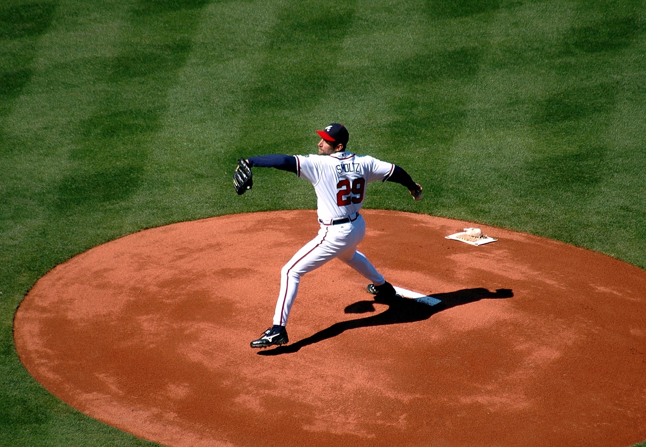 Paid too much? Baseball pitcher in wind-up