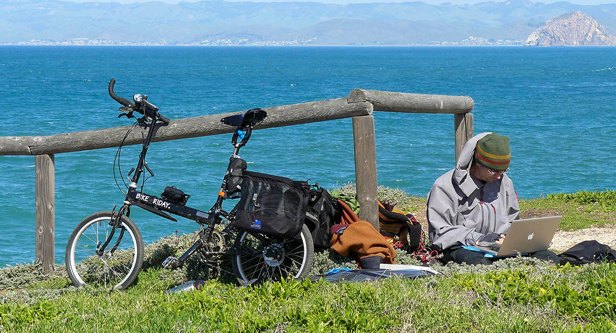 bike traveler with solar-powered laptop