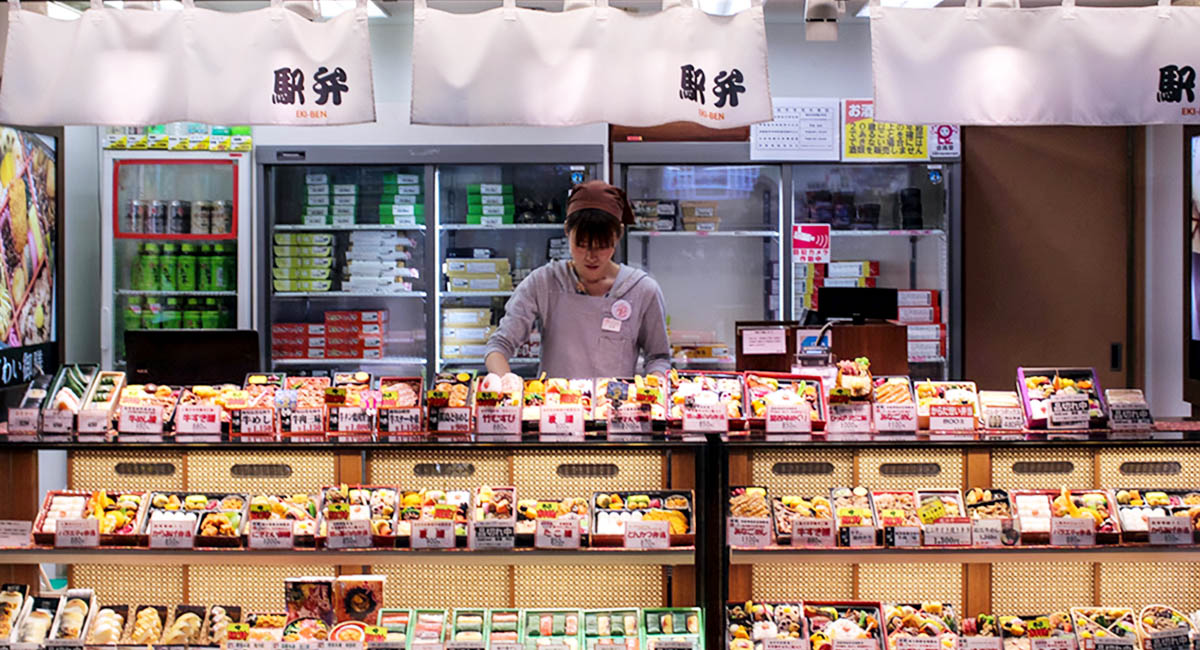 woman behind counter in Japanese convenience store