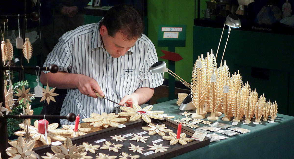 Man doing intricate carving