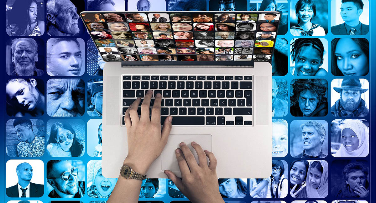 hands on laptop background multicultural