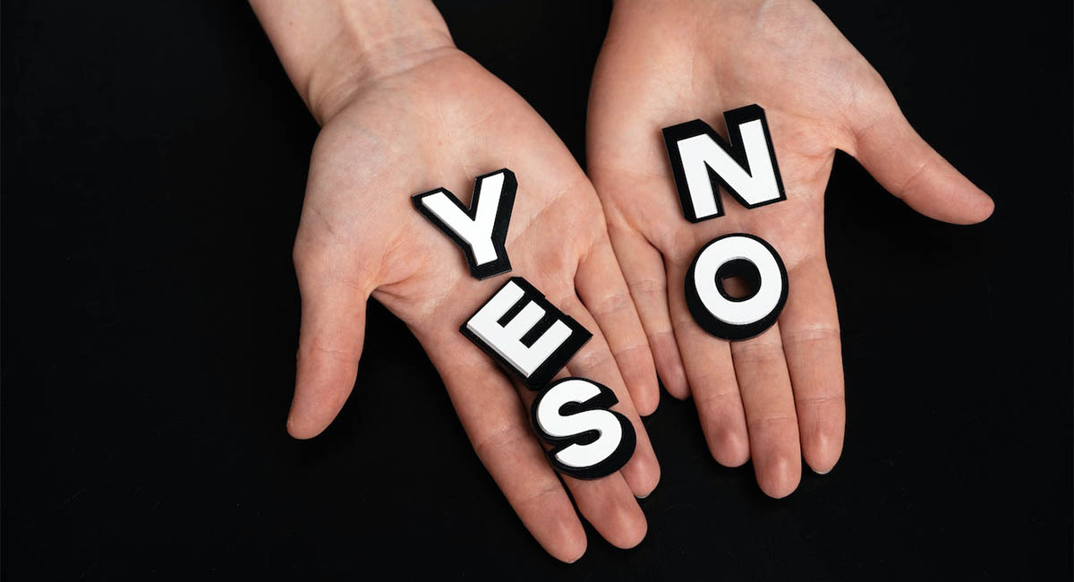 hands holding words yes no in palms