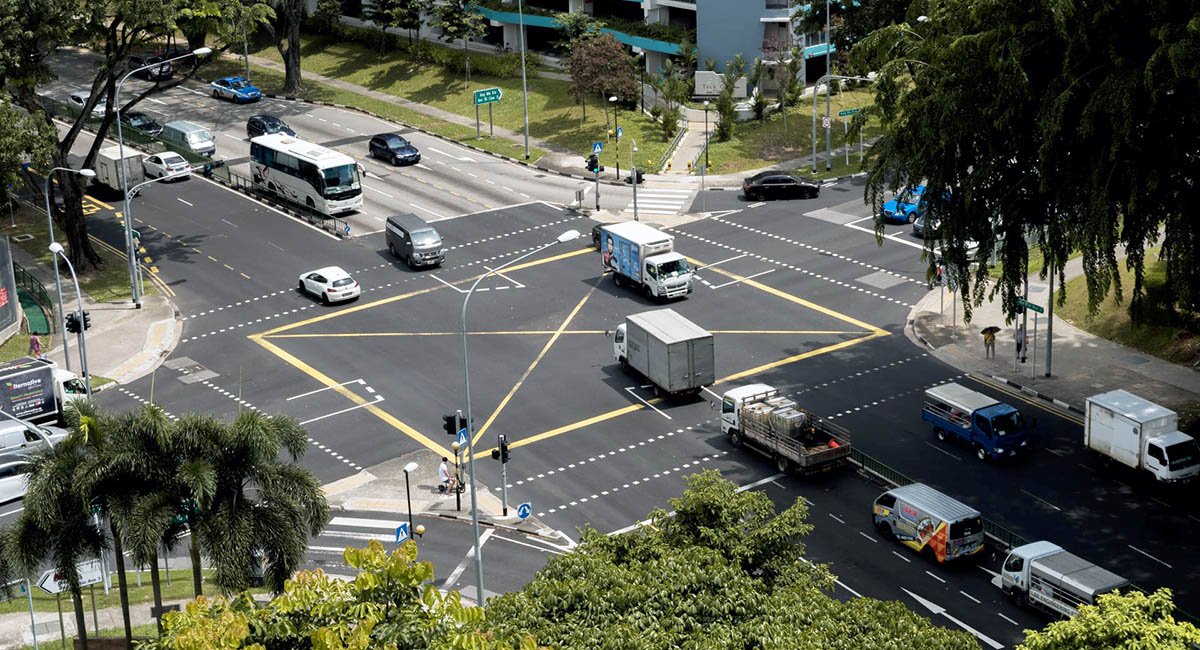 Intersection with cars, trucks, and buses