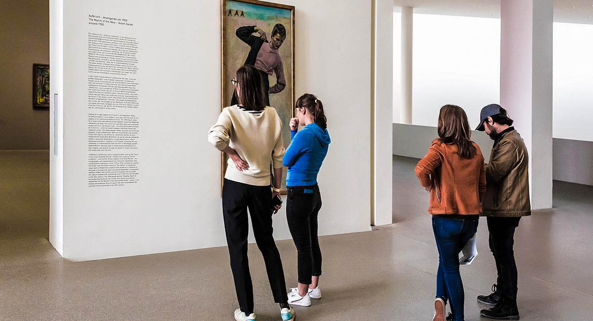 people looking at art in museum