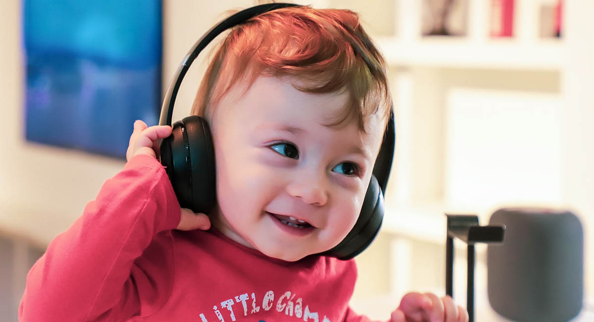 baby headphones smiling