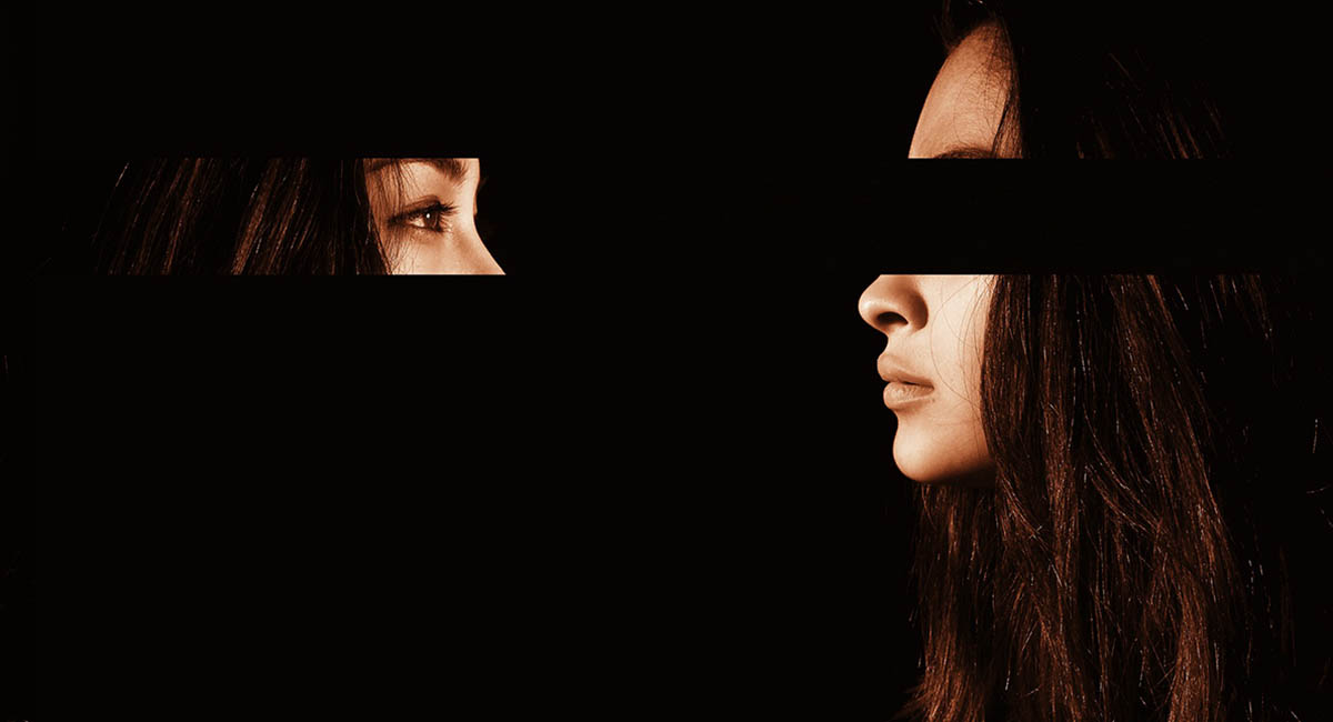 woman, face, black background, photo manipulated to move eyes to look back at face
