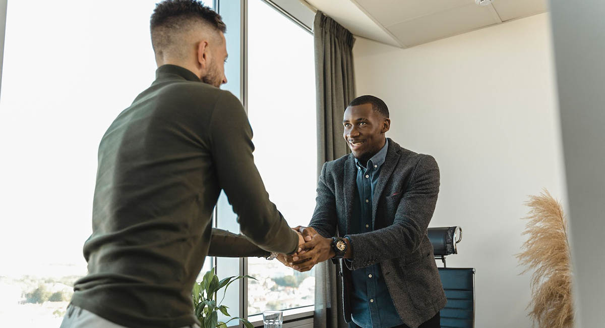 two businessmen shaking hands diversity
