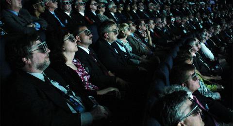 Movie theater, people wearing 3D glasses