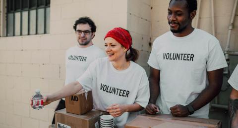 volunteer workers handing out supplies