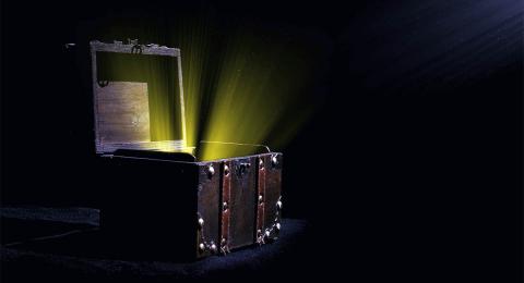 Treasure chest open with gold light shining out