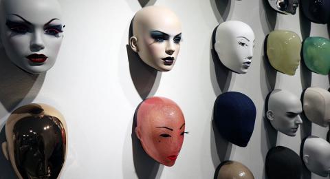 Mannequin heads on a wall