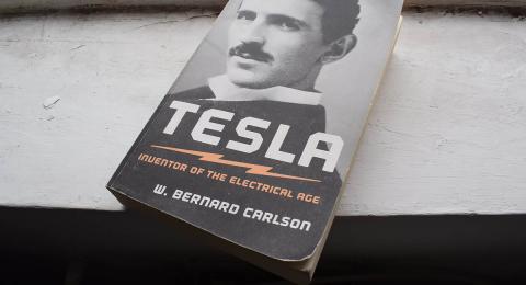 Book on shelf, biography of Tesla