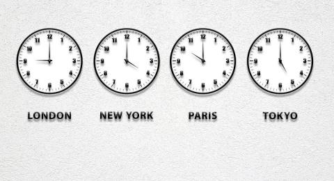 World times shown on 4 clocks on a wall