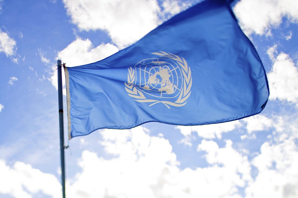 United Nations flag United Nations flag flying with blue sky background